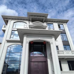 巴中白麻别墅外墙干挂石材效果示例